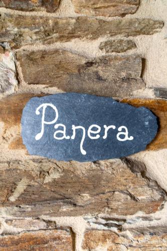 a stone sign that says pantera on a stone wall at Complejo Rural Lar de Vies in A Pontenova