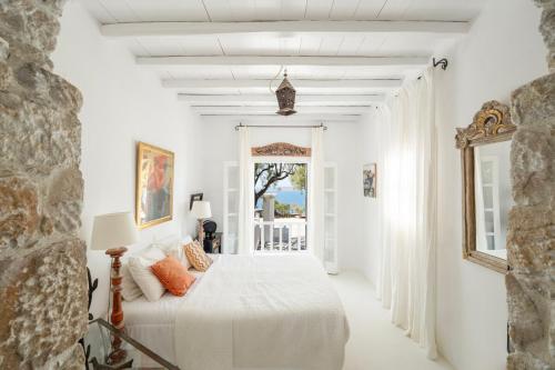Ένα ή περισσότερα κρεβάτια σε δωμάτιο στο Villa BlueRock by Mykonos Mood