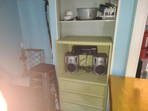 two speakers on a shelf in a room at ARMANI MANOR Rustic UNIT 2 in Wildwood