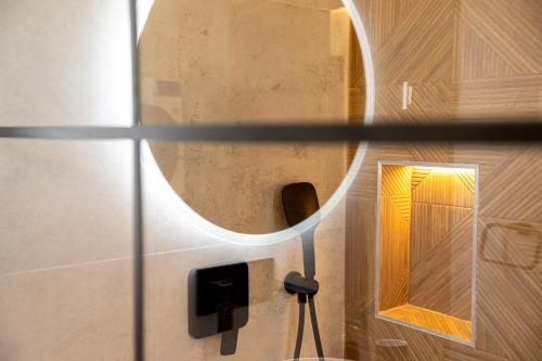 a bathroom with a mirror on the wall at Villa Mianka Rab in Banjol