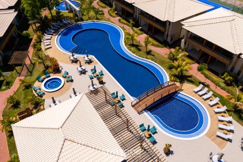 an overhead view of a swimming pool at a resort at Apto Charmoso com Vista para Piscina! - BIO0079 in Camaçari