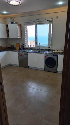 Küche/Küchenzeile in der Unterkunft Joli Loft F5 location Bousmail