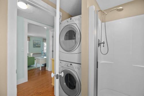 a laundry room with a washer and dryer at Point of Happiness - Bourne in Bourne