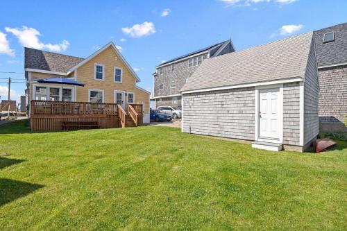 a large yard with a house and a garage at Life of Reilly - Scituate in Scituate