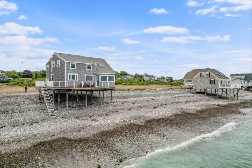 a house and two houses on the beach at Stunning and Stilted - Scituate in Scituate
