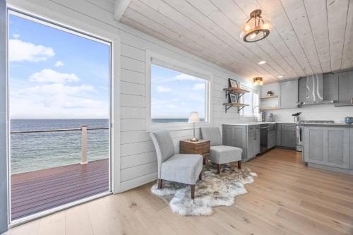 a kitchen with a view of the ocean at Stunning and Stilted - Scituate in Scituate