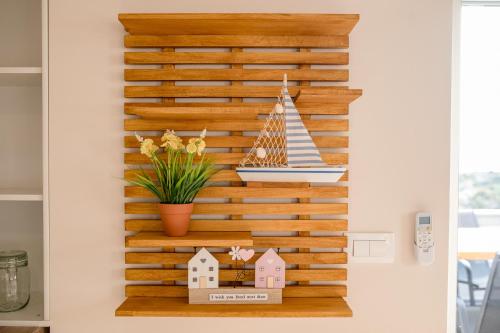 a wooden wall with a scale with a boat on it at Gabriel Home in Rab