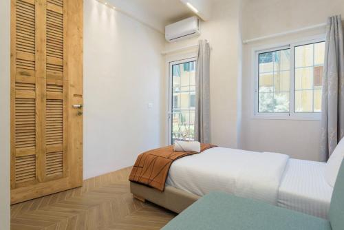 a bedroom with a bed and a window at Tulip 2BR Apartment in Gemayze in Beirut