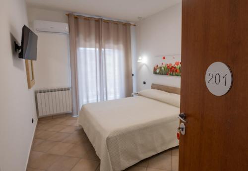 Postel nebo postele na pokoji v ubytování B&B SediciMarzo