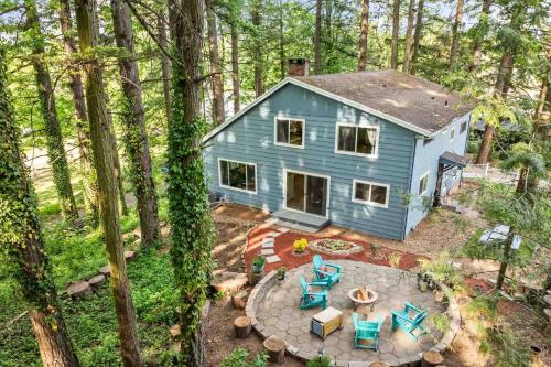 an overhead view of a blue house in the woods at Kanate Timber in Gresham