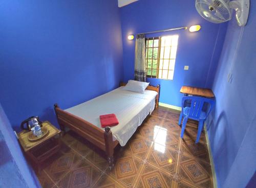 Postel nebo postele na pokoji v ubytování Khmer House Guesthouse