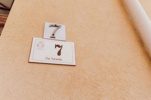 two signs on the side of a table with the word va benefits at Locri Beautiful Modern Three-Room Apartment in Locri
