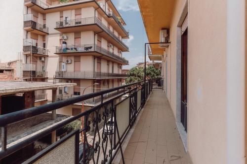 a balcony with a view of a building at Locri Beautiful Modern Three-Room Apartment in Locri