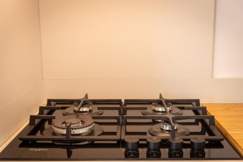 a stove top oven sitting in a kitchen at Villa Mianka Rab in Banjol