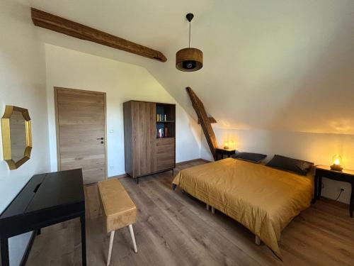 Postel nebo postele na pokoji v ubytování Gîte la grange de Jeanne