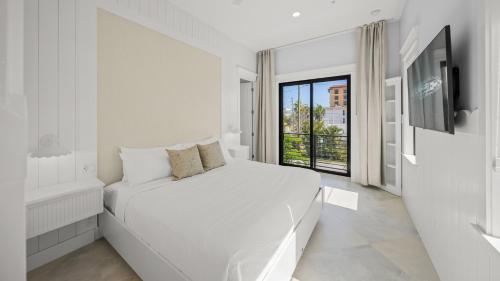 Ένα ή περισσότερα κρεβάτια σε δωμάτιο στο Sapphire Shores