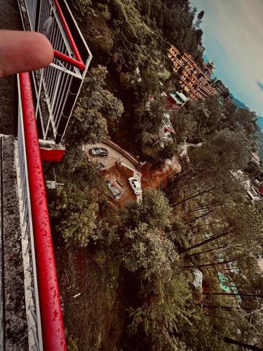 an overhead view of a mountain with trees at Nature View Home Stay in Mandi