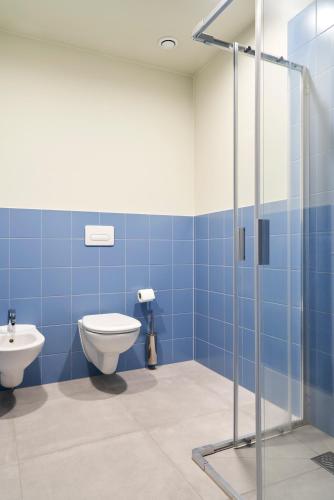 a bathroom with a toilet and a sink at aparto Milan Durando in Milan