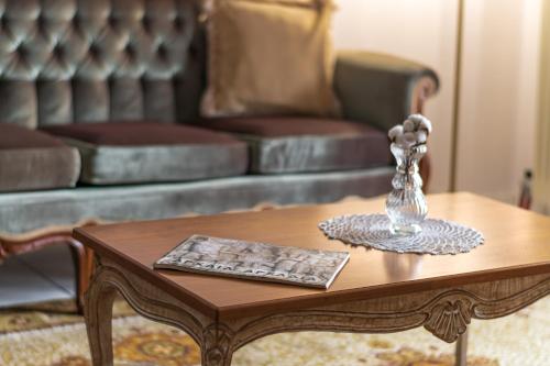 a coffee table in a living room with a couch at 4keys House 4 in Tripolis