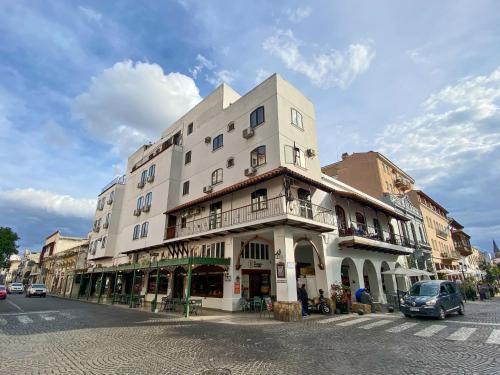a large white building on the side of a street at Hotel Regidor in Salta
