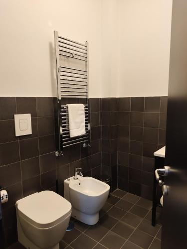 a bathroom with a toilet and a sink at Altoledo Rooms and Suite in Naples