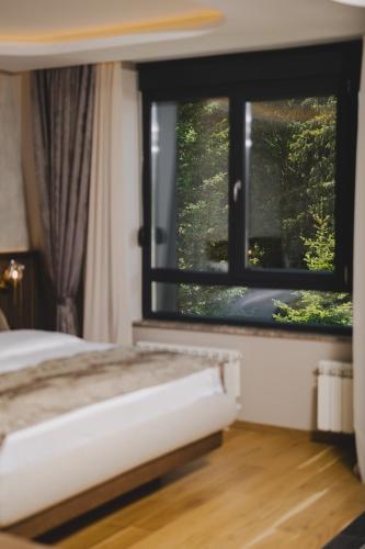 Un ou plusieurs lits dans un hébergement de l'établissement Hotel Rezident