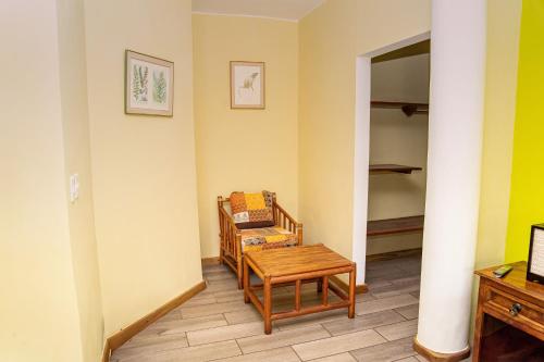 a small room with a table and a chair at Banana Palms Hotel in Rio Dulce
