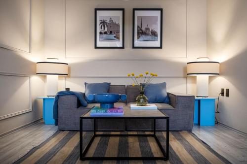 a living room with a couch and a table at AmazINN Collection CDMX Insurgentes in Mexico City