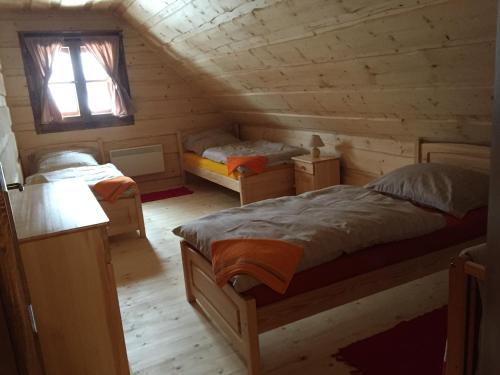 Postel nebo postele na pokoji v ubytování Drevenica u Michala