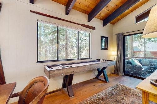 a home office with a pool table in front of a window at Simplon Pass Escape in Homewood