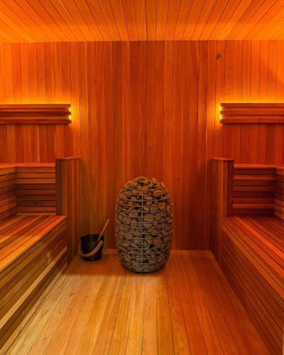 a empty sauna with a bucket in the middle at Polaris in Kelsall