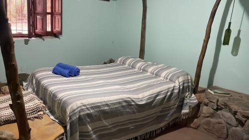 Postel nebo postele na pokoji v ubytování cabaña bodeguita de adobe