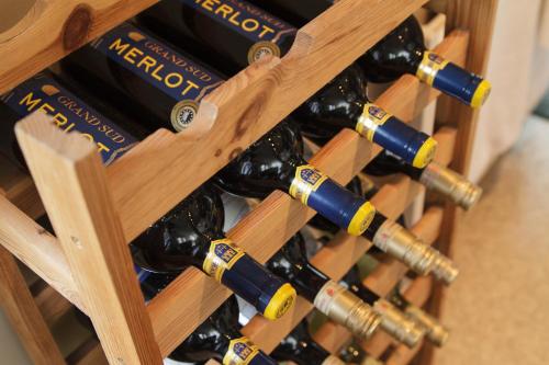 a bunch of wine bottles in a wooden crate at Hotel Pankow in Berlin