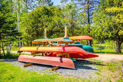 a group of surfboards sitting on a pile of rocks at Suites du Lac Moore by Manitonga in Mont-Tremblant