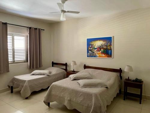 Ένα ή περισσότερα κρεβάτια σε δωμάτιο στο Hotel Carajás