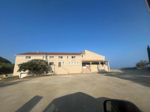 a shadow of a house on the side of a road at F2 apartments with panoramic sea views in Farinole