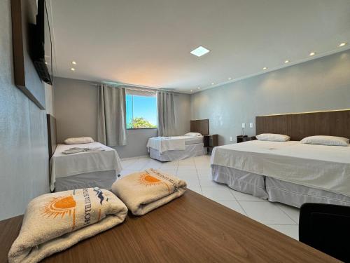 Postel nebo postele na pokoji v ubytování Hotel Luar de Itapua