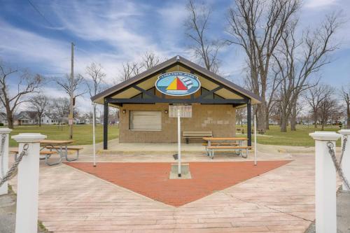 a building with a sign on it in a park at 1 Block to Beach Home with Hot Tub in Port Clinton! in Port Clinton