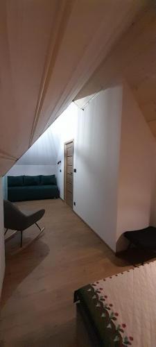 a room with a bed and a couch in a room at Domek u Socków in Zakopane