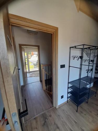 a room with a door and a glass shelf at Domek u Socków in Zakopane