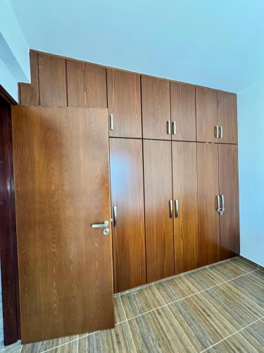 a row of wooden lockers in a room at Lazuli Zen Villa with Private Pool in Pyla