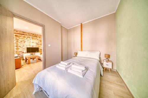 Ένα ή περισσότερα κρεβάτια σε δωμάτιο στο Pepita home