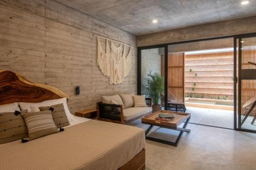 Ένα ή περισσότερα κρεβάτια σε δωμάτιο στο Jiloo Punta Zicatela Adults Only (1)