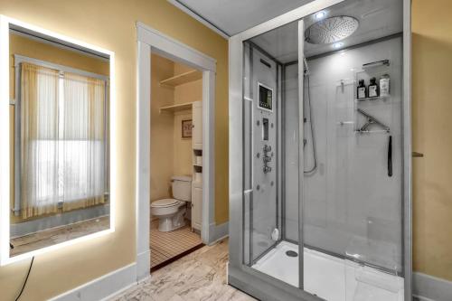a bathroom with a shower and a toilet at Spacious Niagara Falls Air Conditioning Parking Steam Shower in Niagara Falls