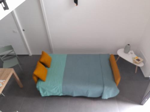 Un ou plusieurs lits dans un hébergement de l'établissement La casetta di Lu' Loft con 1 camera da letto