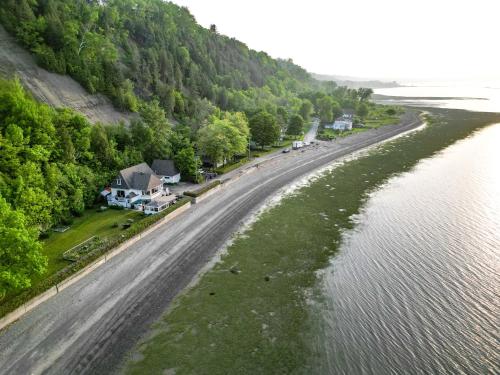 an aerial view of a road next to a river at Le Repaire du Fleuve in Sainte-Croix