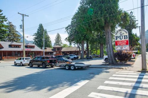 a car hooked up to a truck on a street at The Backyard at Cedar Springs Walk to Lake and Hot Springs in Harrison Hot Springs