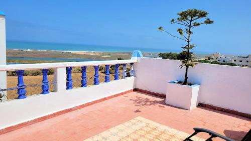 a balcony with a view of the ocean at Maison de la Lagune in Oualidia