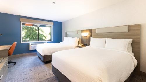 a hotel room with two beds and a window at Holiday Inn Express Bellingham by IHG in Bellingham