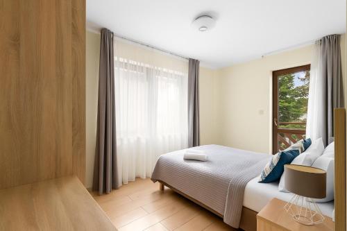 Postel nebo postele na pokoji v ubytování HoliApart Willa Stenga - Kącik zabaw dla dzieci, przyjazny czworonogom